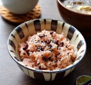 A bowl of sekihan, red bean rice, served as part of a Japanese meal.