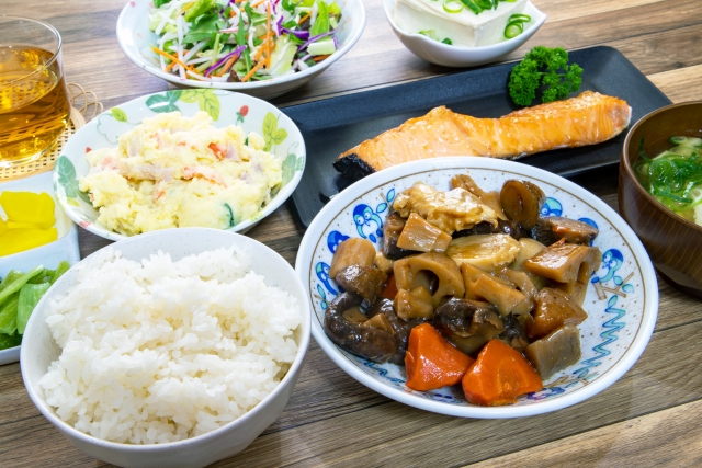 Typical Japanese home dinner set with rice, miso soup, and side dishes