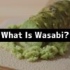 What is wasabi? Freshly grated hon-wasabi rhizome on a traditional grater