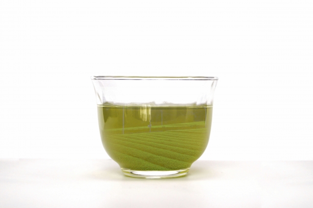 Cloudy deep-green fukamushi-cha with fine tea particles visible in a glass cup