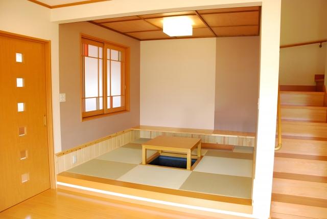 Modern home with a raised tatami platform (koagari washitsu) integrated into wooden flooring.