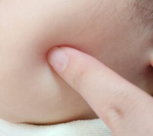 Soft human skin being gently pressed to illustrate the Japanese expression mochihada