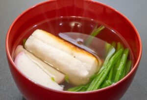 alt="Ozoni, a traditional Japanese New Year soup with mochi and vegetables, with many regional variations"
