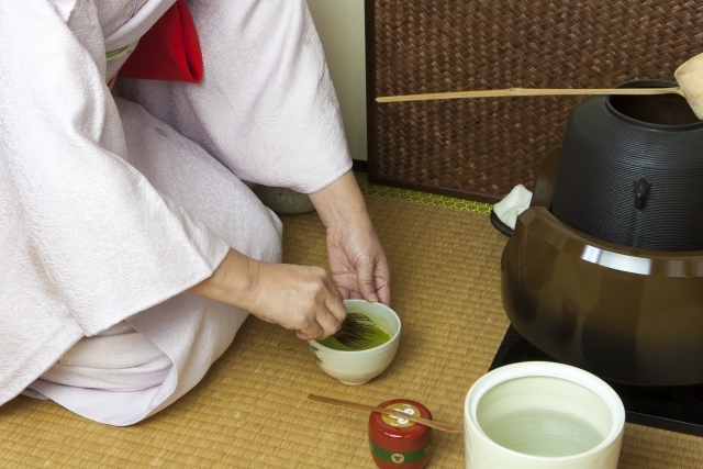 Matcha being whisked directly in a tea bowl during a Japanese tea ceremony