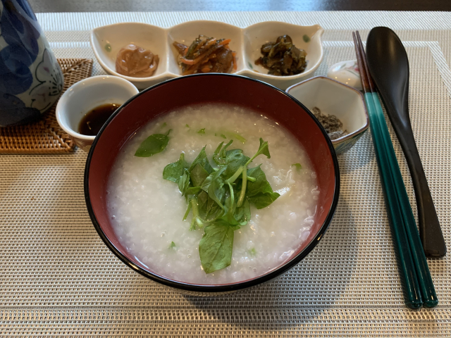 Nanakusa-gayu served as part of a simple Japanese meal with small side dishes