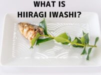 Hiiragi iwashi on a plate: a grilled sardine head attached to a sprig of holly leaves