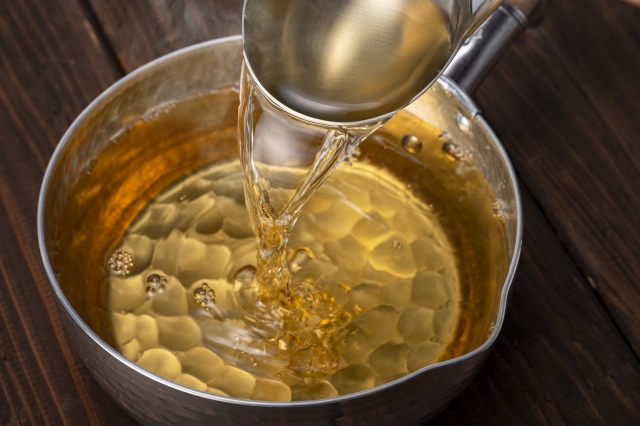 Making dashi stock with water in a Japanese pot