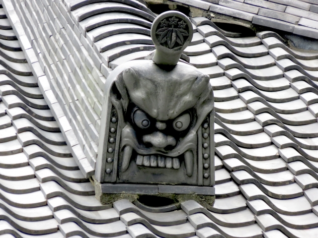 Onigawara roof tile with a fierce oni face, used to protect buildings from misfortune in Japan