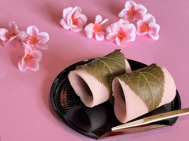 Chōmeiji-style sakura mochi with a thin crepe-like wrapper and sweet red bean paste inside