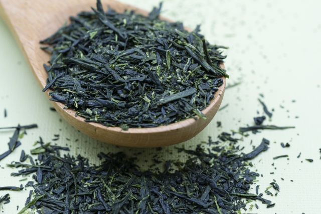 Close-up of dried Japanese green tea leaves before brewing