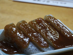 Konnyaku topped with a glossy sweet miso sauce, served as Japanese dengaku.