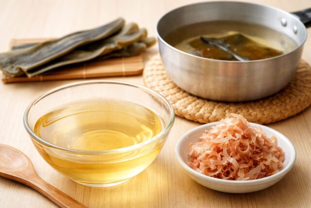 Clear ichiban dashi broth with kombu and katsuobushi ingredients used in Japanese cooking