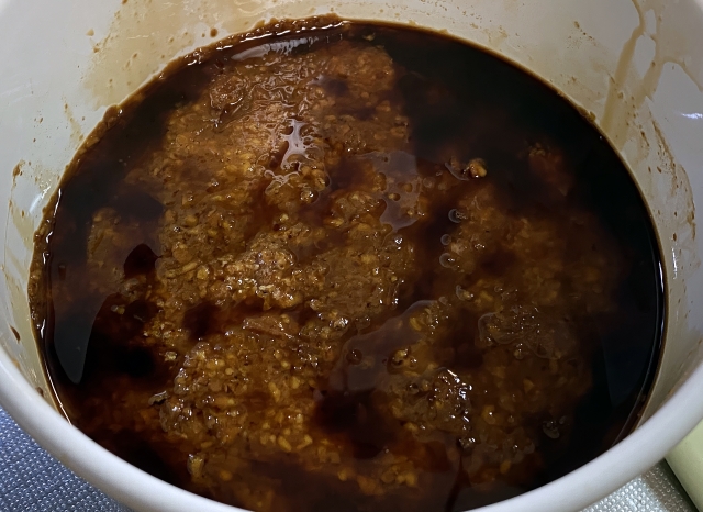 Tamari liquid forming on top of fermenting soybean mash