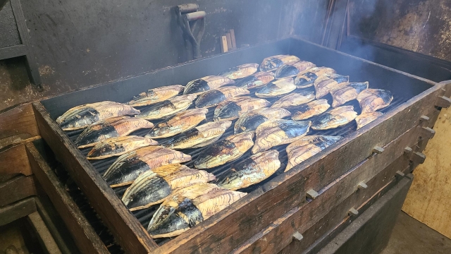 bonito fillets being smoked during the katsuobushi production process