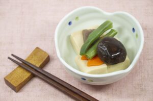 Koya-dofu simmered in dashi broth, a traditional Japanese dish