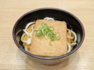Udon noodles served in a clear dashi broth typical of western Japan
