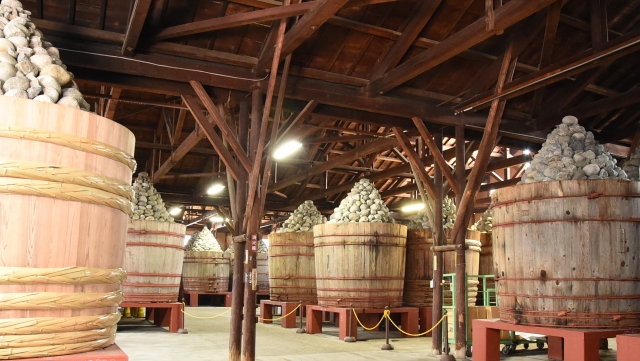 Traditional wooden barrels used for large-scale fermentation of soy-based foods