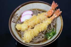 Tempura soba noodles served in hot dashi broth