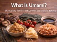 Ingredients rich in umami such as kombu, katsuobushi, miso, tomatoes, mushrooms, and soy sauce displayed together to illustrate the savory taste that defines Japanese cooking