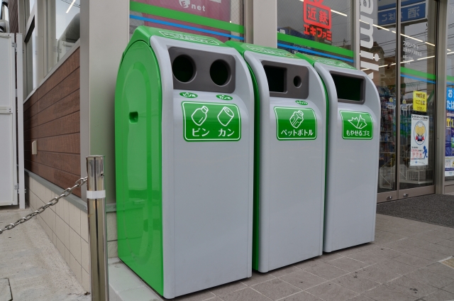 Recycling bins for bottles and cans outside a Japanese convenience store