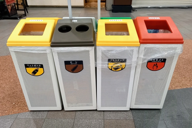 Indoor recycling bins in Japan sorted for PET bottles, cans, plastics, and burnable waste