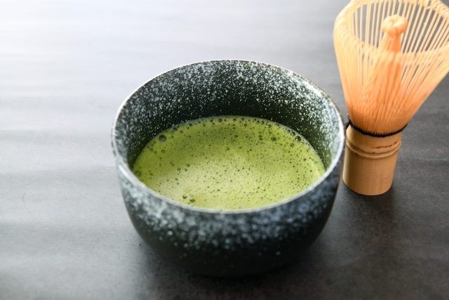 Prepared matcha tea with smooth foam in a bowl