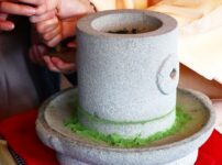 Traditional stone mill grinding matcha tea leaves slowly