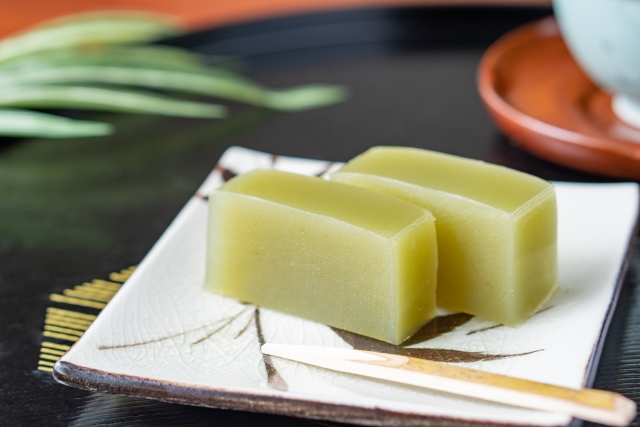 Japanese matcha yokan sweet on a plate with smooth texture