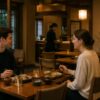 Foreign visitors enjoying a quiet meal in a calm Japanese restaurant while staff remain in the background to avoid interrupting the dining atmosphere