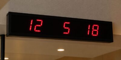 Digital number display panel showing table call requests inside a Japanese restaurant