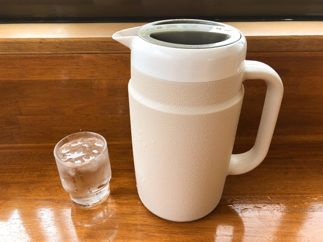 Water pitcher and glass placed on a restaurant counter in Japan