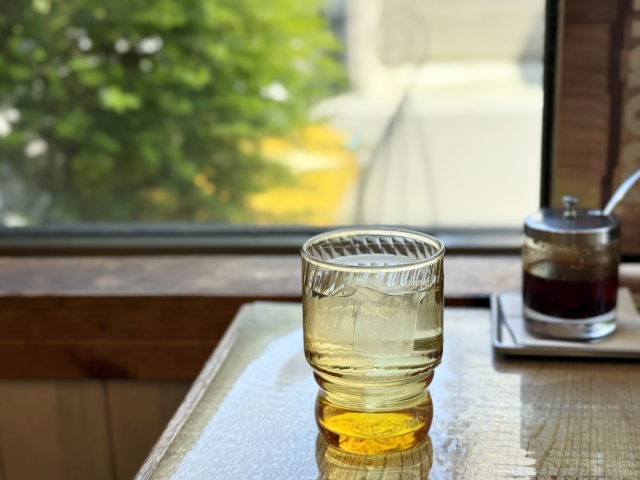Glass of barley tea served at a Japanese restaurant table