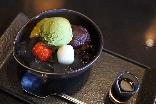 Japanese matcha dessert with matcha ice cream, azuki, shiratama, fruit, and agar jelly