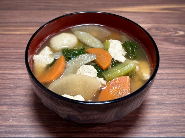 A bowl of kenchin-jiru, a Japanese vegetable soup with tofu and root vegetables, showing how soup contributes ingredients as well as warmth to an ichiju sansai meal.