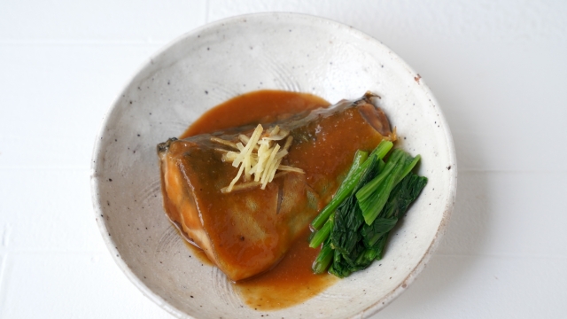 A serving of simmered mackerel in miso sauce, illustrating a typical main dish in an ichiju sansai meal.