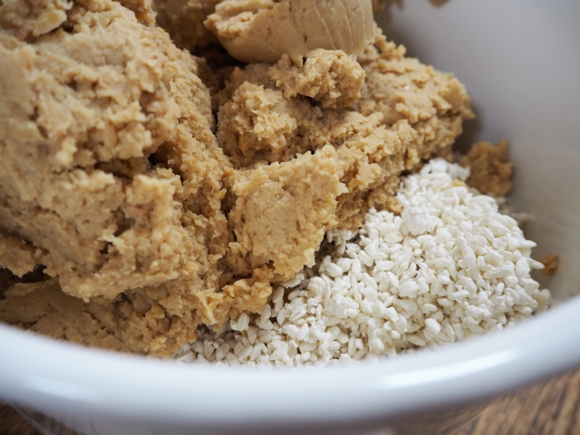 Cooked soybeans and koji being prepared for fermentation.