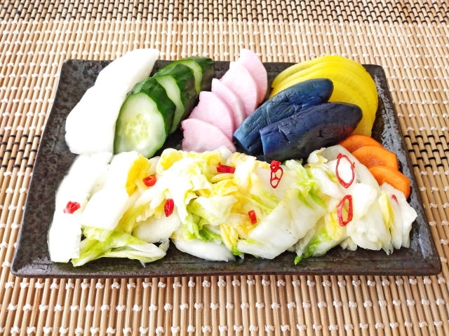 An assortment of Japanese tsukemono, including pickled cucumber, daikon, turnip, eggplant, carrot, and cabbage.