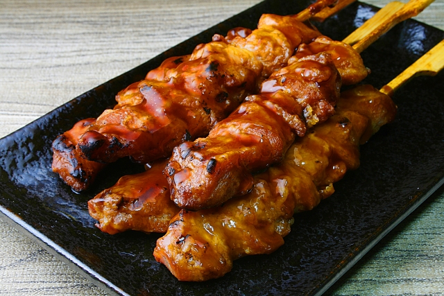 Yakitori skewers glazed with a glossy soy sauce-based tare.