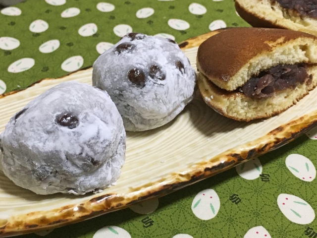 Shio daifuku and dorayaki filled with anko on a plate