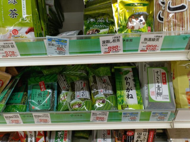 Karigane and other Japanese green teas displayed with prices in a supermarket