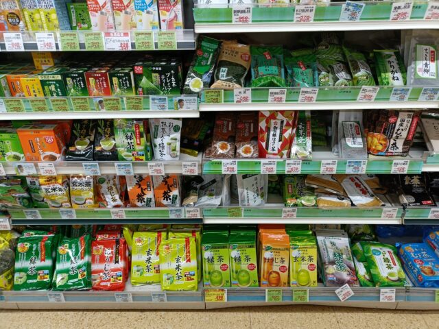 Japanese supermarket tea shelf with kukicha, karigane, sencha, hojicha, and other teas