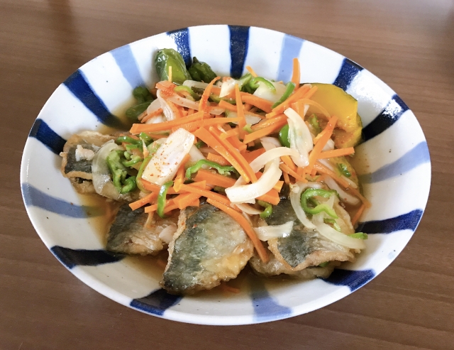 Japanese Aji Nanbanzuke with fried horse mackerel, onions, carrots, and green peppers in a sweet-and-sour marinade.