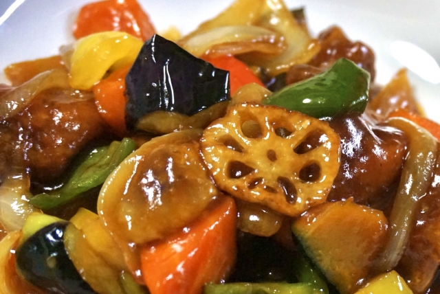 Japanese-style sweet-and-sour pork made with black vinegar, vegetables, and lotus root.